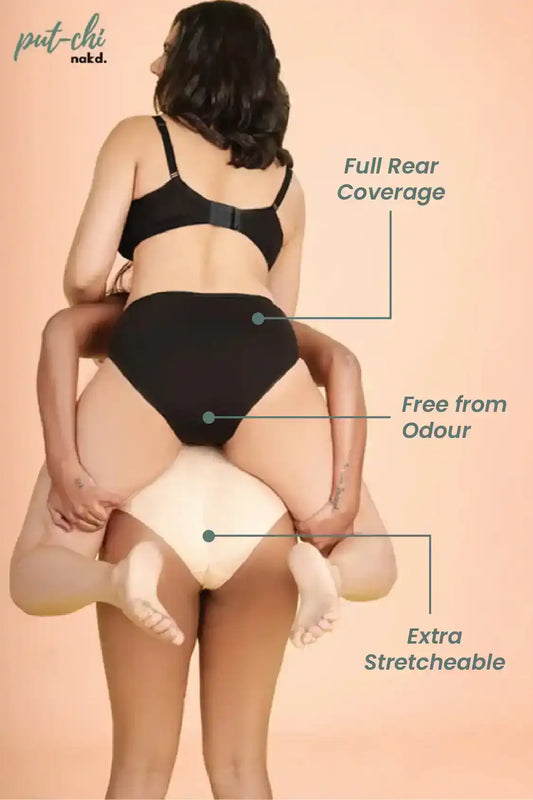 a woman wearing a black and white dress