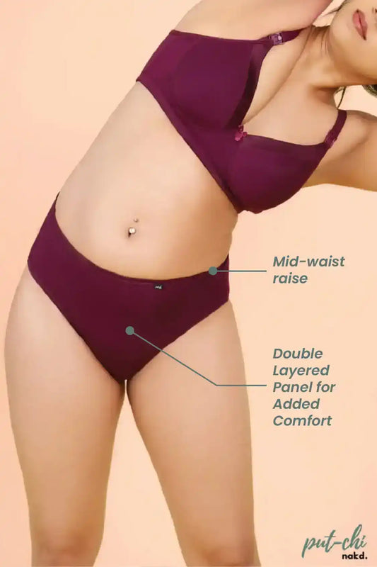 a woman in a skirt sitting on a table