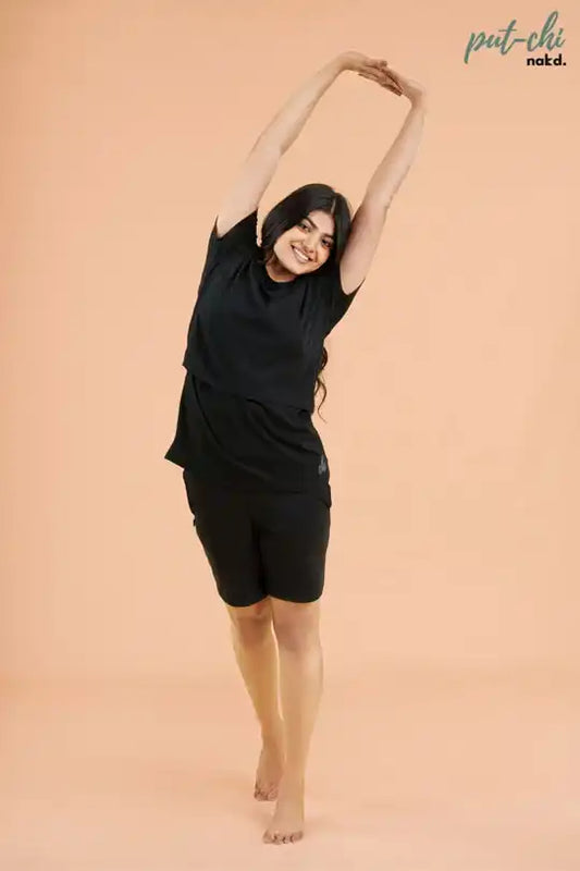 a woman is holding a tennis racket in her hand