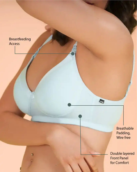 a woman in a bikini holding a surfboard