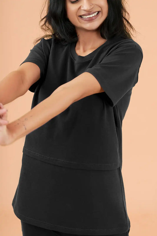 a woman in a black shirt and a black shirt