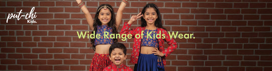 Three children in colorful outfits posing against a brick wall with 'put-chi Kids' branding.