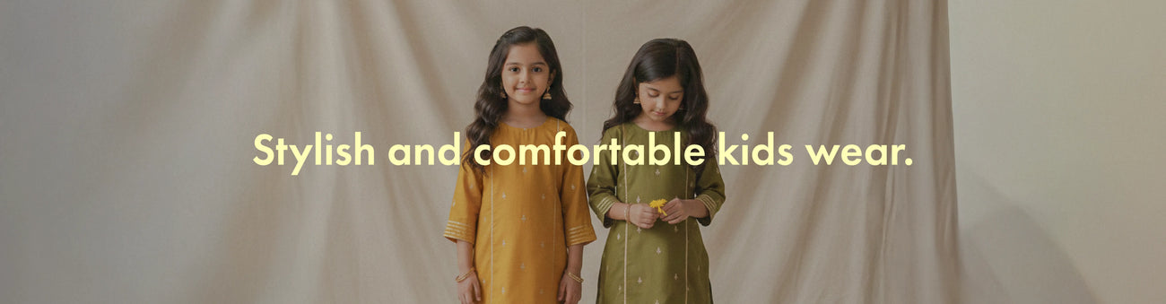 Two children wearing stylish and comfortable kids' clothing with a text overlay on a plain background.