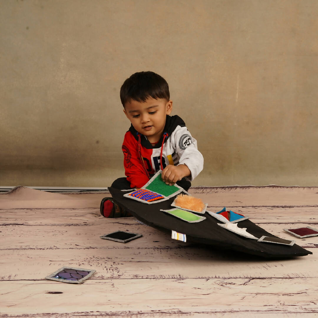 a young boy is sitting on a skateboard 